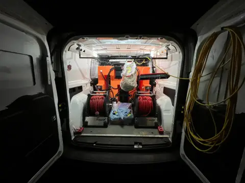 Water-fed pole window cleaning equipment in the New Wave Cleaning van