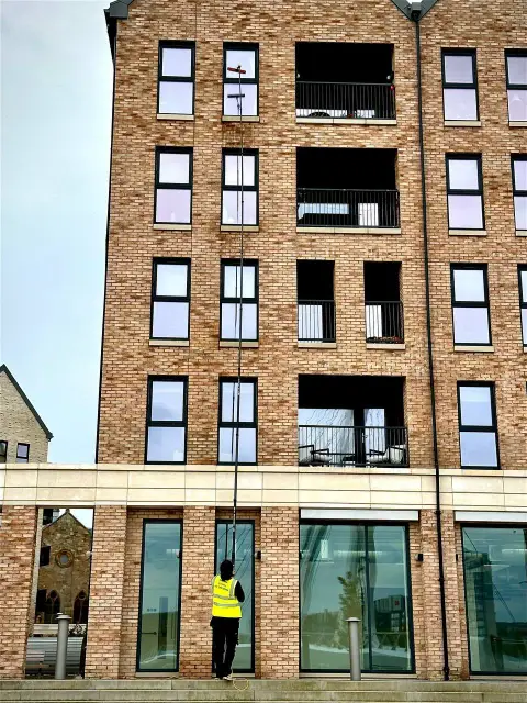 High reach window cleaning of a modern apartment building
