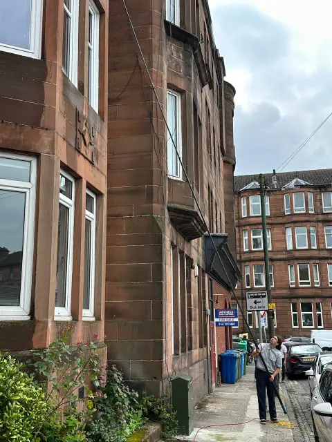 New Wave Cleaning technician on a residential street in Glasgow